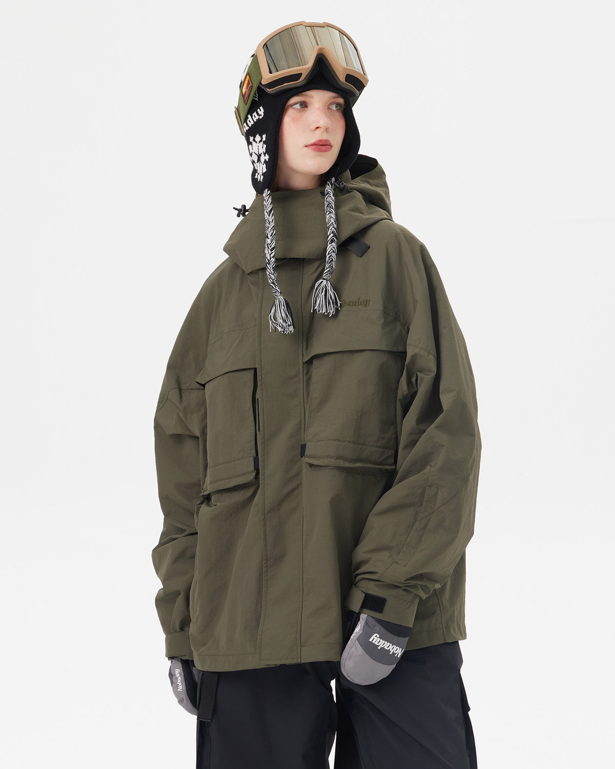 Front view of the NOBADAY Women's Pure Free Freestyle dark green snow jacket with oversized utility pockets and adjustable cuffs