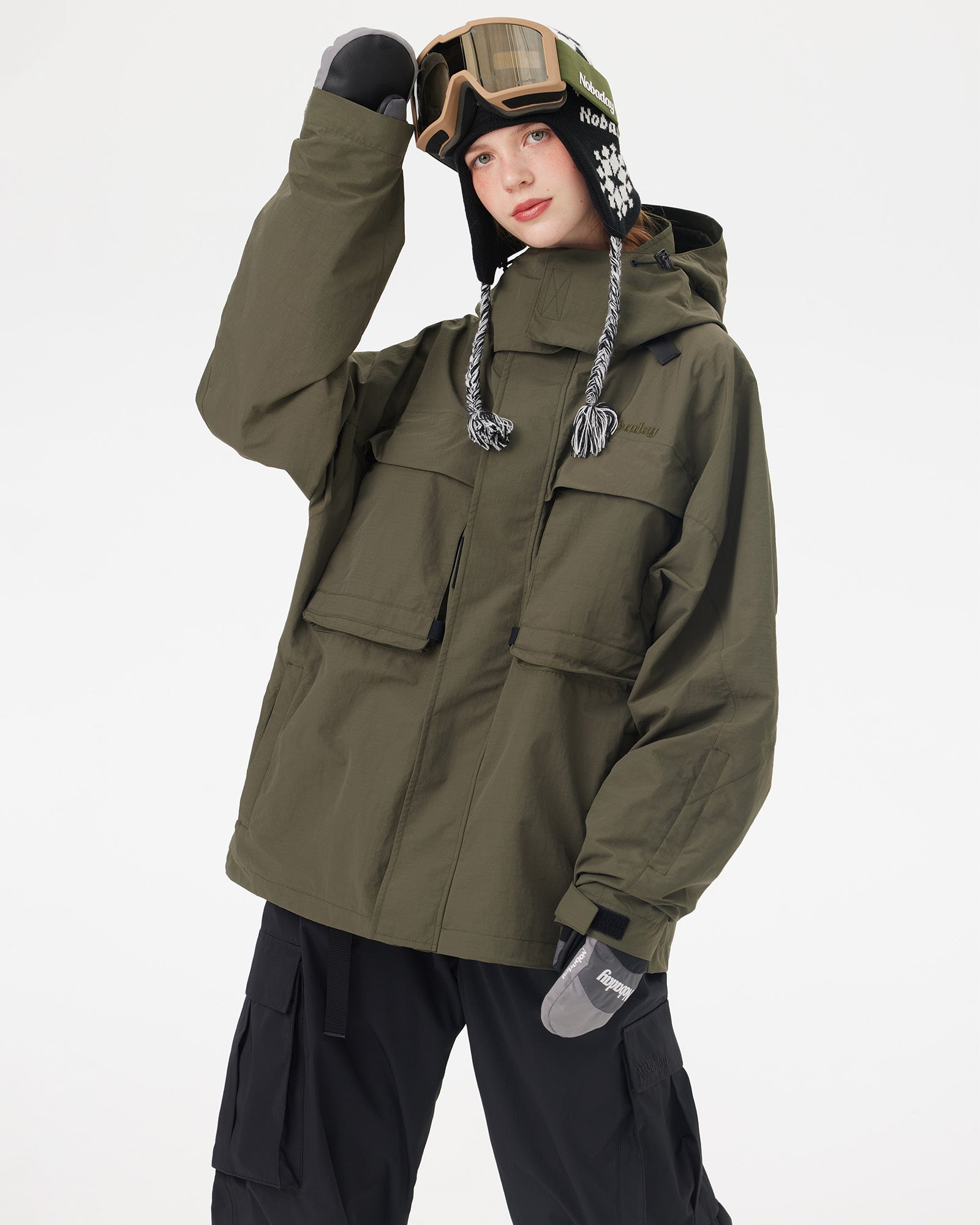Half-body pose of a woman wearing the NOBADAY Women's Pure Free Freestyle dark green waterproof snow jacket