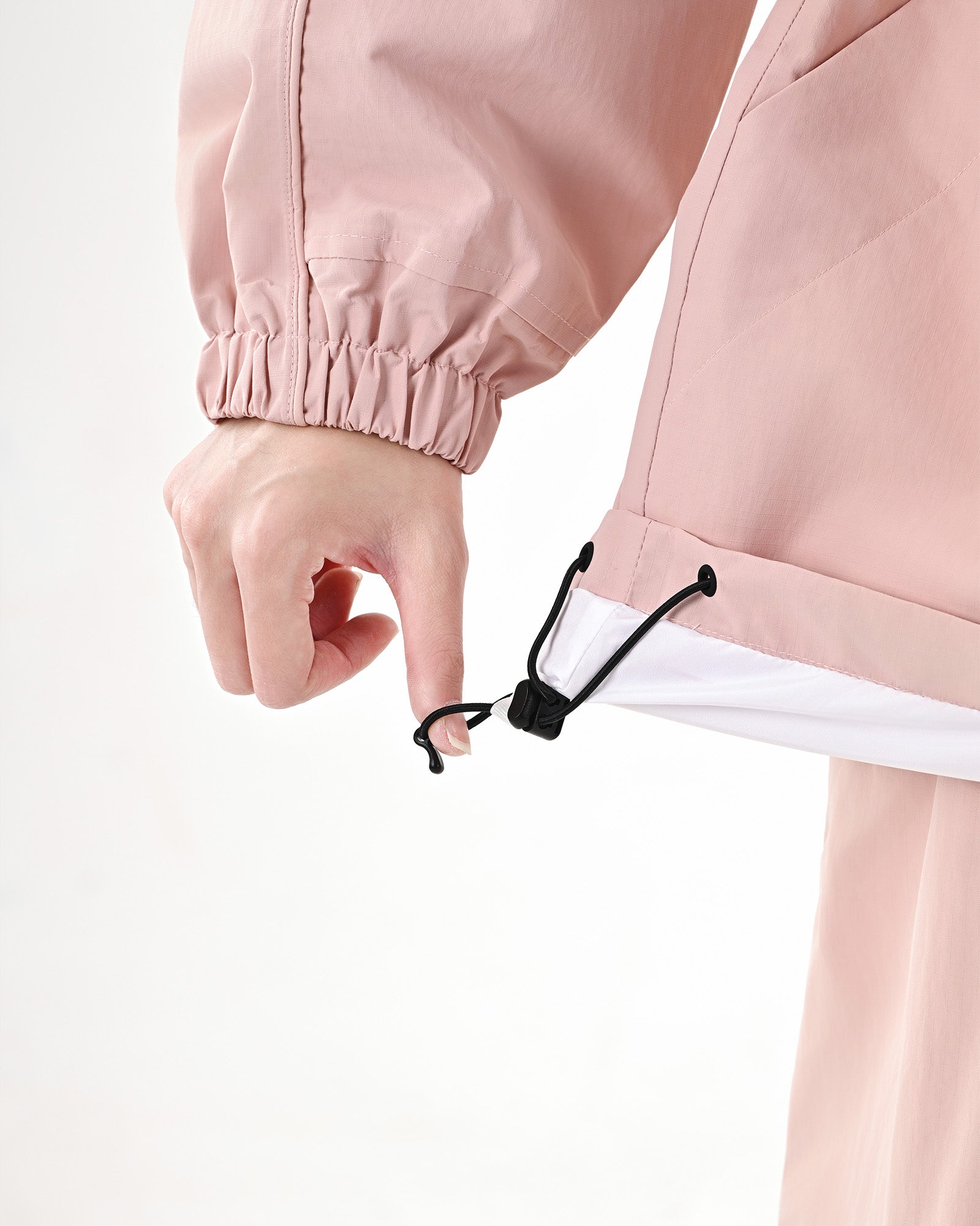 Adjustable drawcord hem detail on the Nobaday Women's Pure Free Snow Jacket in pink