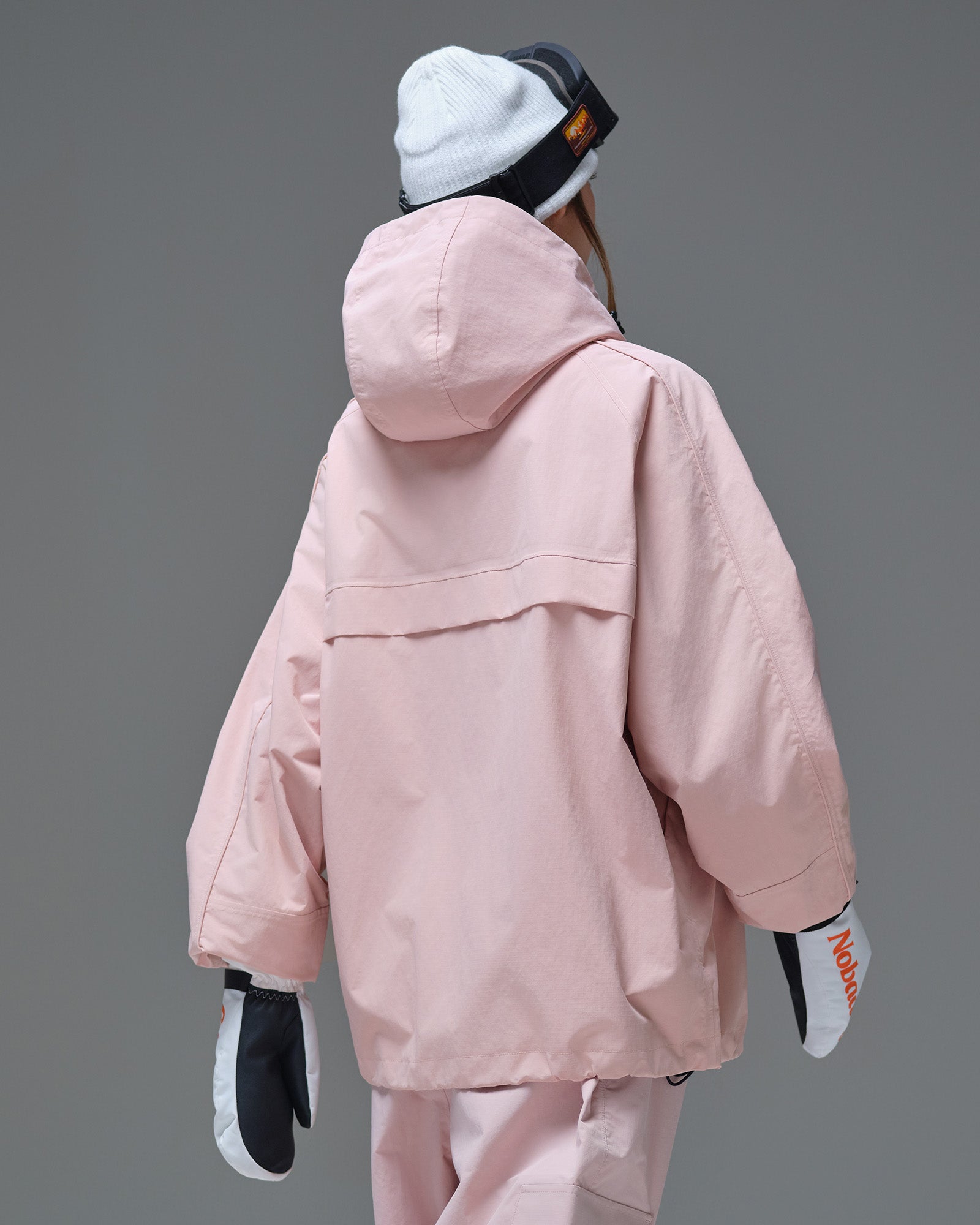 Back view of the Nobaday Women's Pure Free Snow Jacket in pink with an adjustable hood