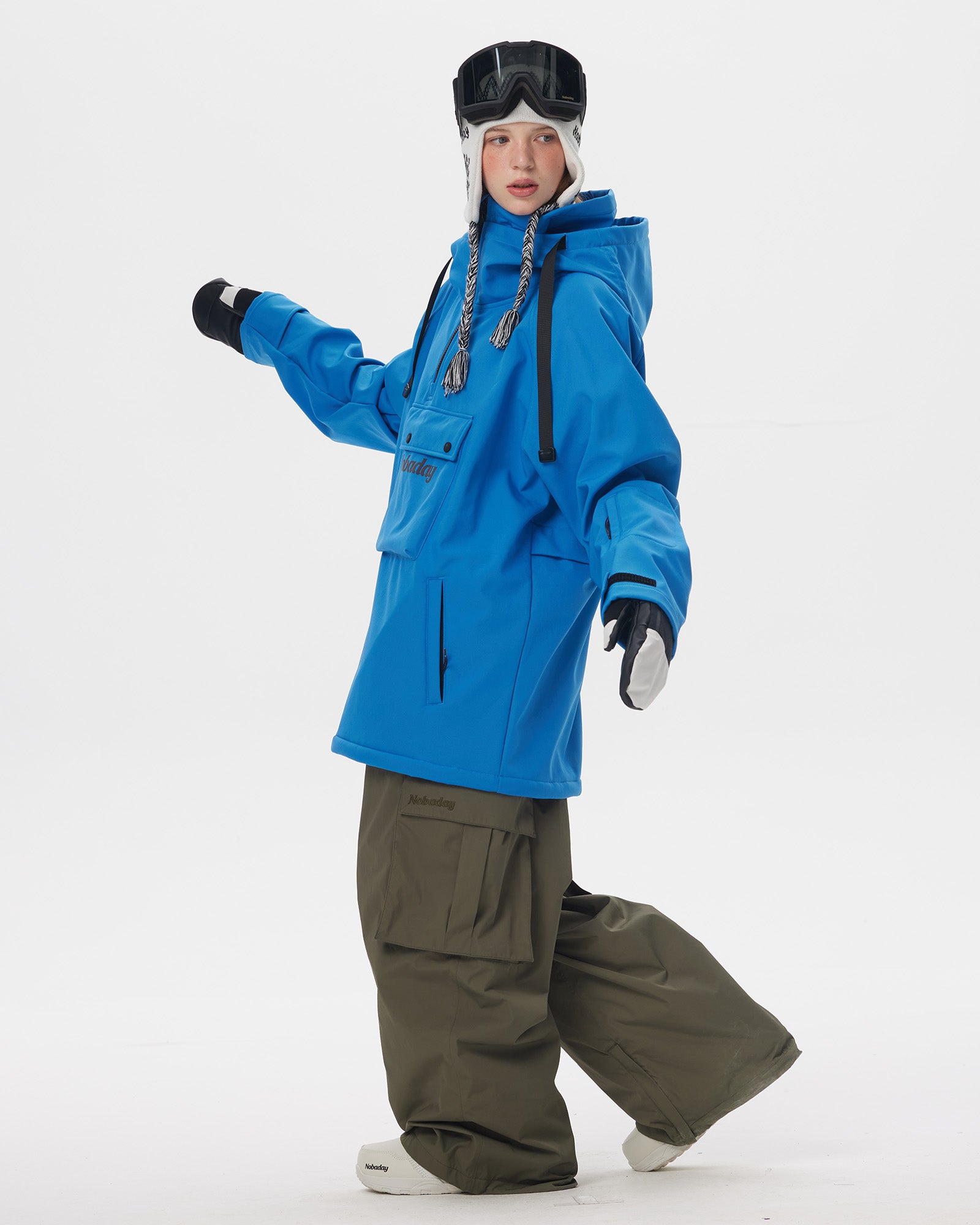 Full body side pose of Nobaday Women's Pure Free Softshell Fleece Hoodie Blue with oversized fit, high collar, and snowboard styling