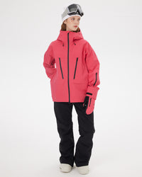 Full-body front view of a woman wearing the NOBADAY Women's SnowShield Pro 3L red waterproof snow jacket with black snow pants